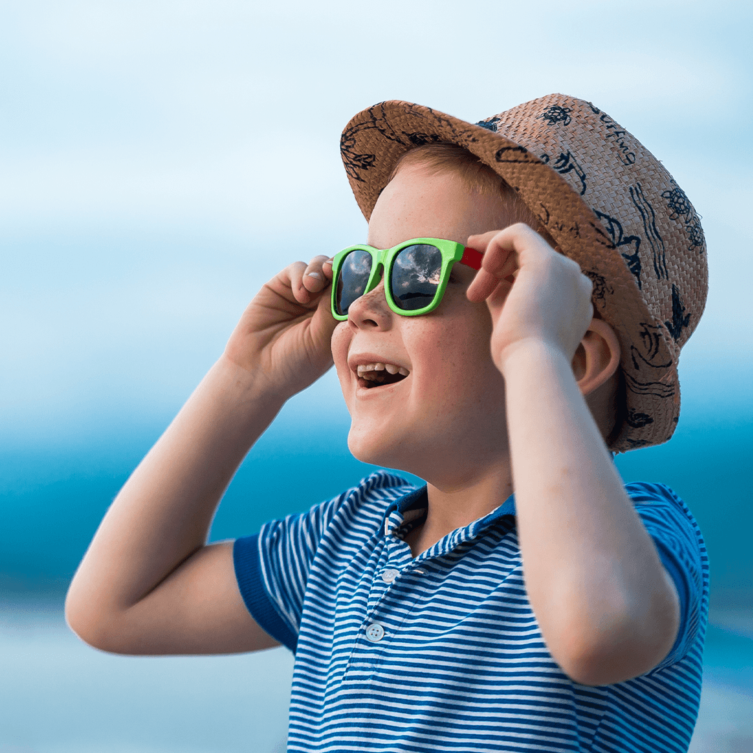 Child in sunglasses enjoying a sunny day – fun summer activities for kids